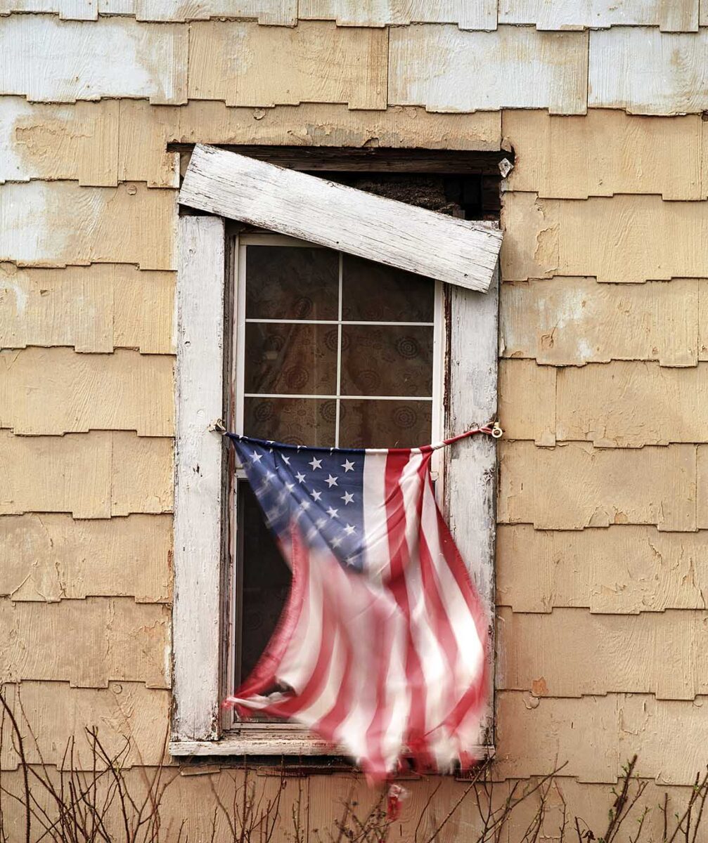 FLAG FLYING WINDOW - Magnet Ave. (occupied) © tom sullens