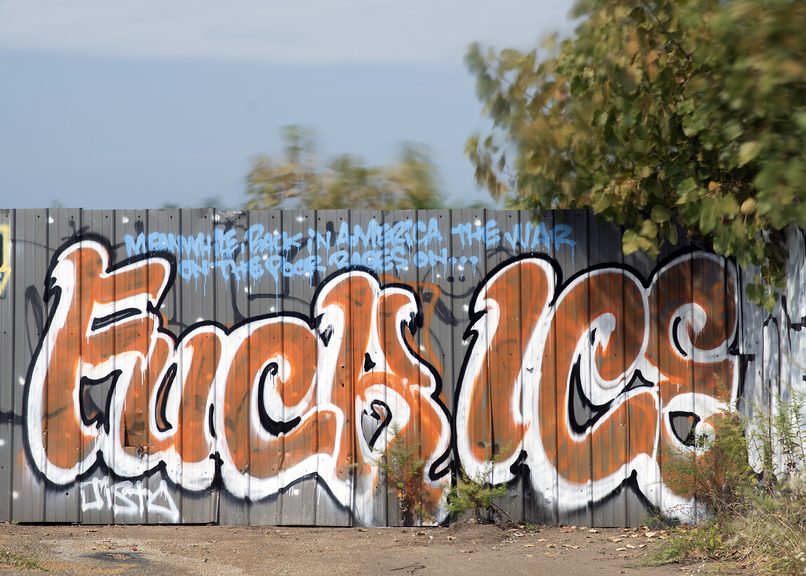 Fuck Ice is graffiti on a fence in cleveland oh