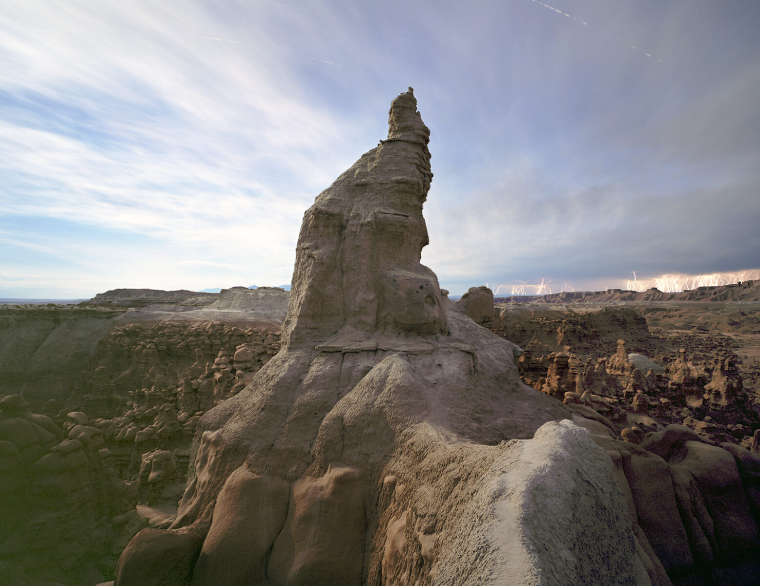 hoodooo rock formation and lightming storm in goblin valley, utah