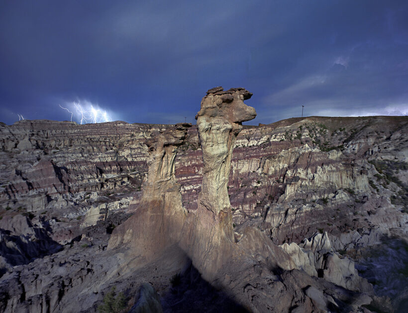 hoodooo rock formation and lightming storm in hell's half acre, Wyoming