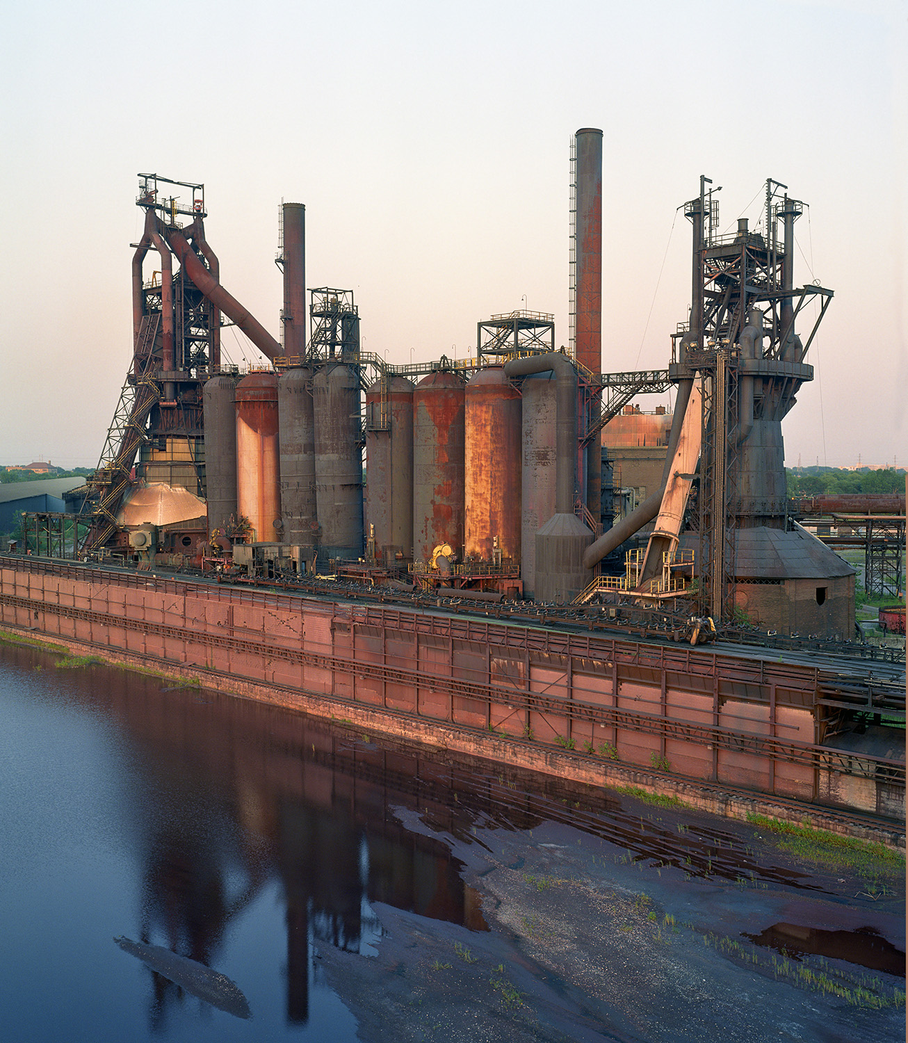 The Acme Mill in December, 2003 - the mill is in full demoilition, the ore yard flooded and empty.