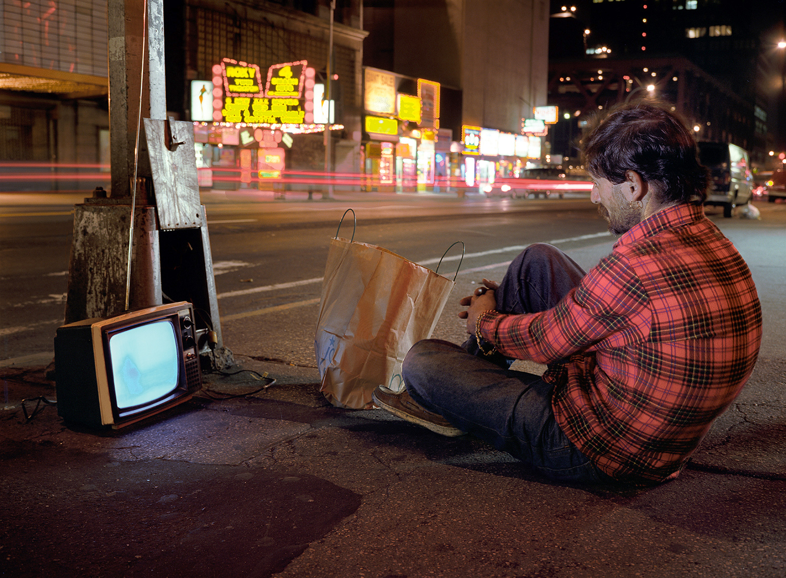 John Watching His Television Plugged into 42nd Street Light Pole