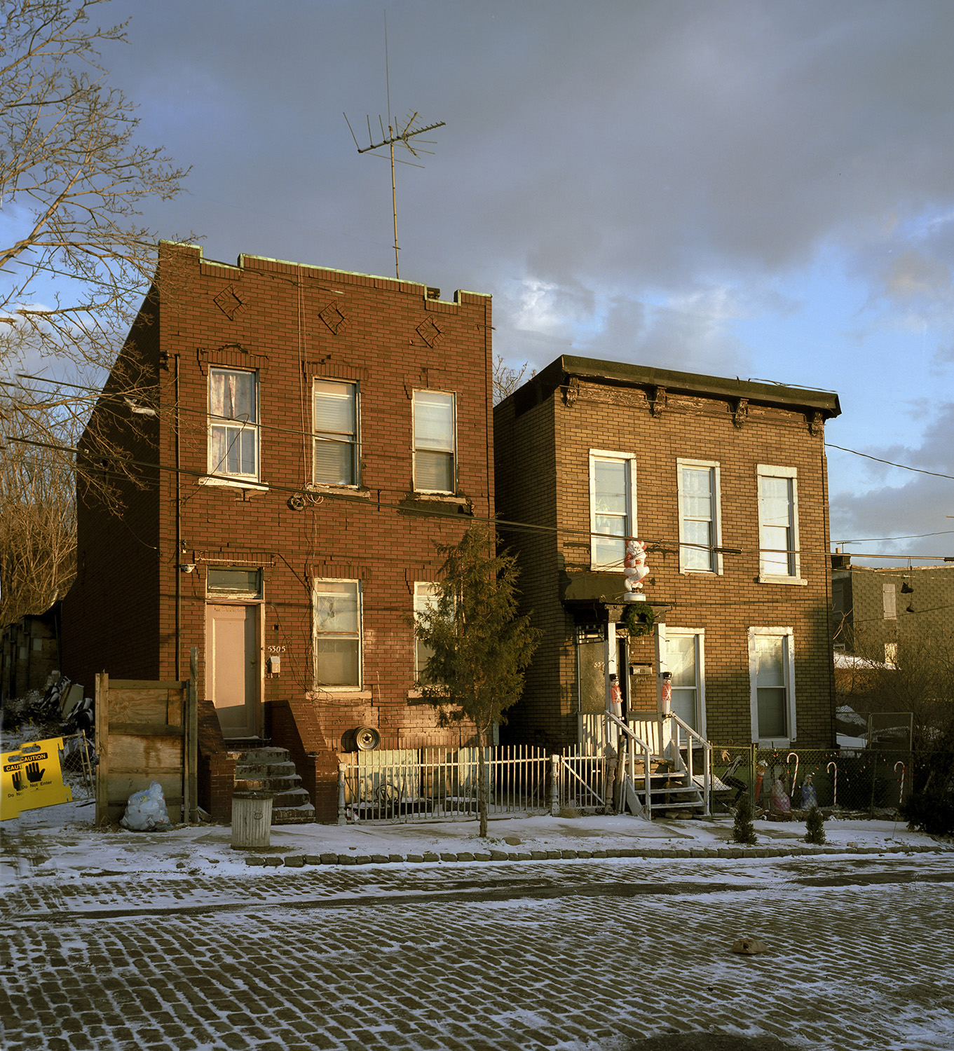 Homes, Locust Street, Queens, snow and dramatic aky.