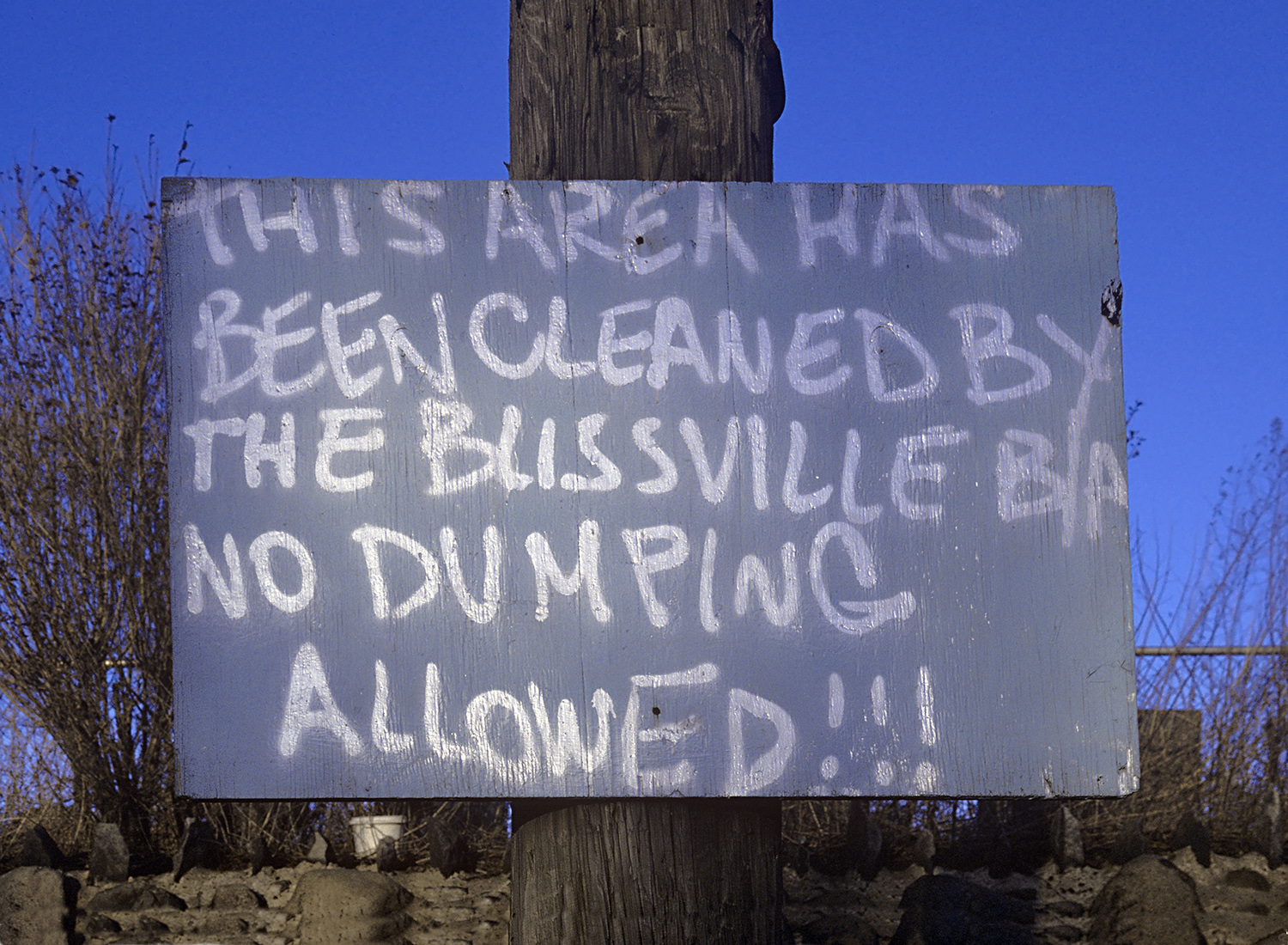 Home-made sign warning dumpers to stya out of Blissville, a small Queens neighborhood along Newtown Creek