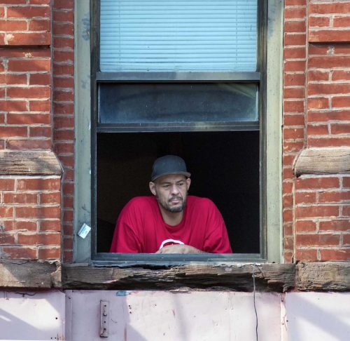 Man Looking Out His Window, East 138th Street, Mott Haven