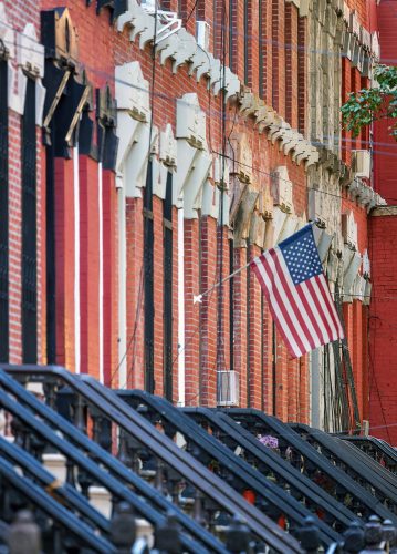 Rowhouses & Flag, East 142st Historic District